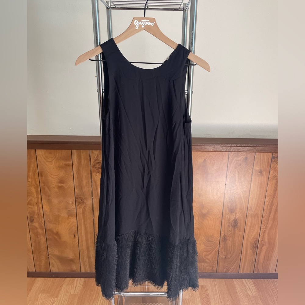 Rachel Roy black dress with fringe on bottom. Size small.